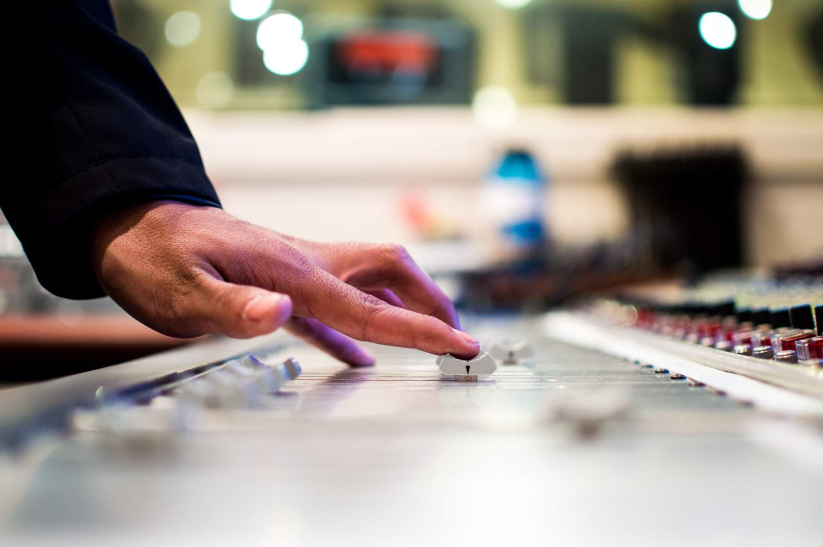 Sliding levers on a sound mixing board