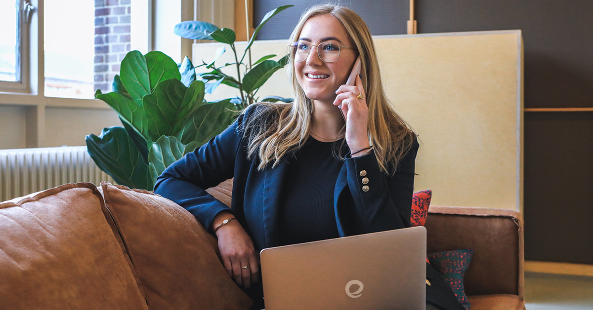 real estate agent talking on phone with laptop