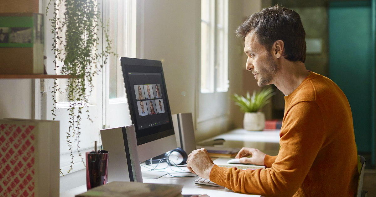 Man in front of computer on a video call